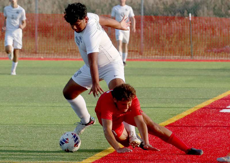 Kaneland's Izach Patino fouls L-P's Giovanni Garcia on Monday, Aug. 28, 2023 at the L-P Athletic Complex in La Salle.
