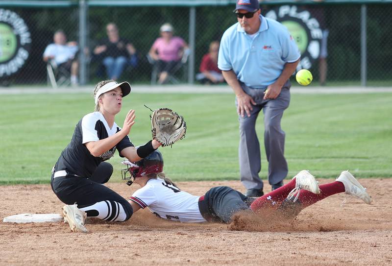 Antioch's Jazzy Fisher slides in with a stolen base as Kaneland's Kailey Plank takes the throw Tuesday, June 7, 2022, during their IHSA Class 3A supersectional game at Kaneland High School in Maple Park.