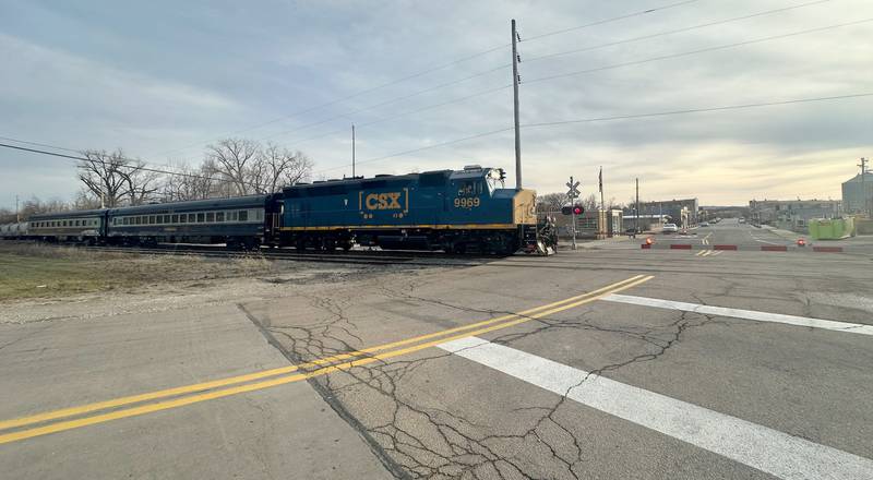 The CSX Geometry Train enters the crossing along Mill Street on Tuesday, Dec. 17, 2024 in Utica. A geometry train inspects the track and checks for defects while reporting them to the engineer.