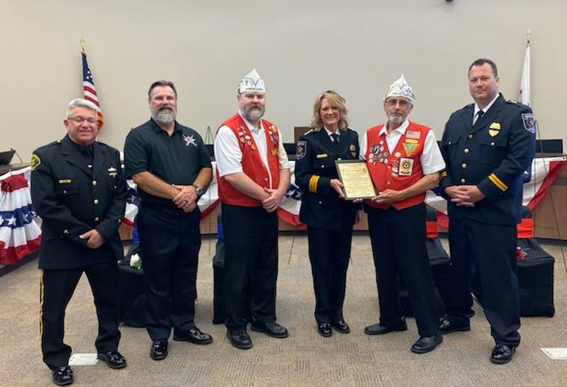 From left: Chaplain Steve Larson; Sgt Steve Huettemann (retired), a Blue Chevalier; Rob Dettmann; Chief Alicia Steffes; Jerry Terando; and Deputy Chief Chad Skelton.
