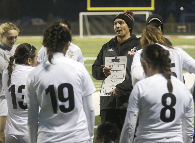 Mchenry coach Andrew Stegenga talks to his team at halftime of a non-conference girls soccer match agains Richmond-Burton Thursday, March 16, 2023, at Richmond-Burton High. McHenry defeated Richmond Burton 4-0, in the first game of the season for both teams.
