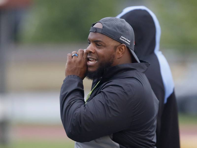 Carmel Catholic Head Coach Jason McKie, a former Chicago Bears fullback, yells to a player during practice Monday Aug. 14, 2023, at the school in Mundelein.