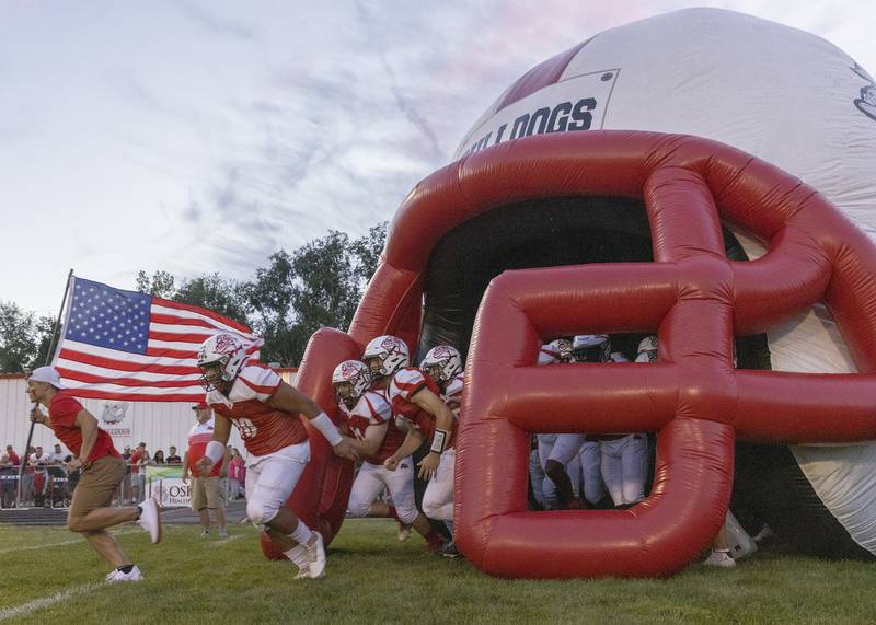 Members of the Streator football team run onto the field on Friday, Sept. 2, 2022 in Streator.