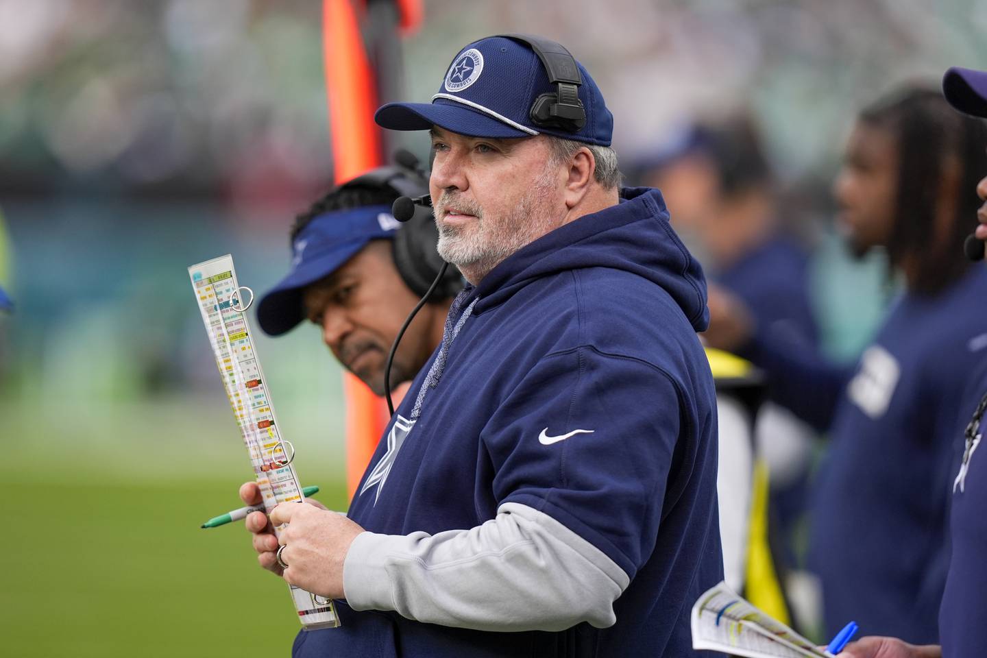 Dallas Cowboys head coach Mike McCarthy looks on during the first half of an NFL football game against the Philadelphia Eagles, Sunday, Dec. 29, 2024, in Philadelphia. (AP Photo/Chris Szagola)