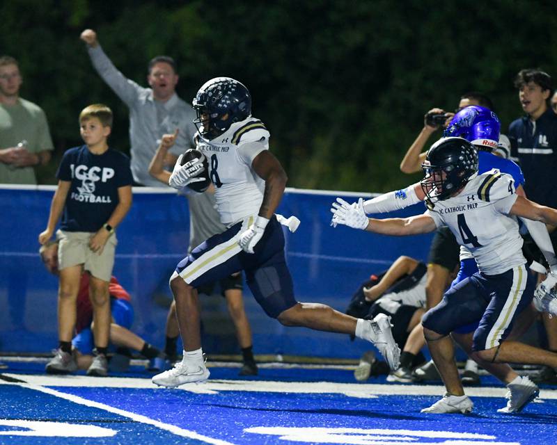 IC Catholic Prep's Tamarion Garner (8) runs the ball into the endzone for a touchdown during the game on Friday Oct. 3, 2025 while taking on IC College Prep held at St. Francis High School.