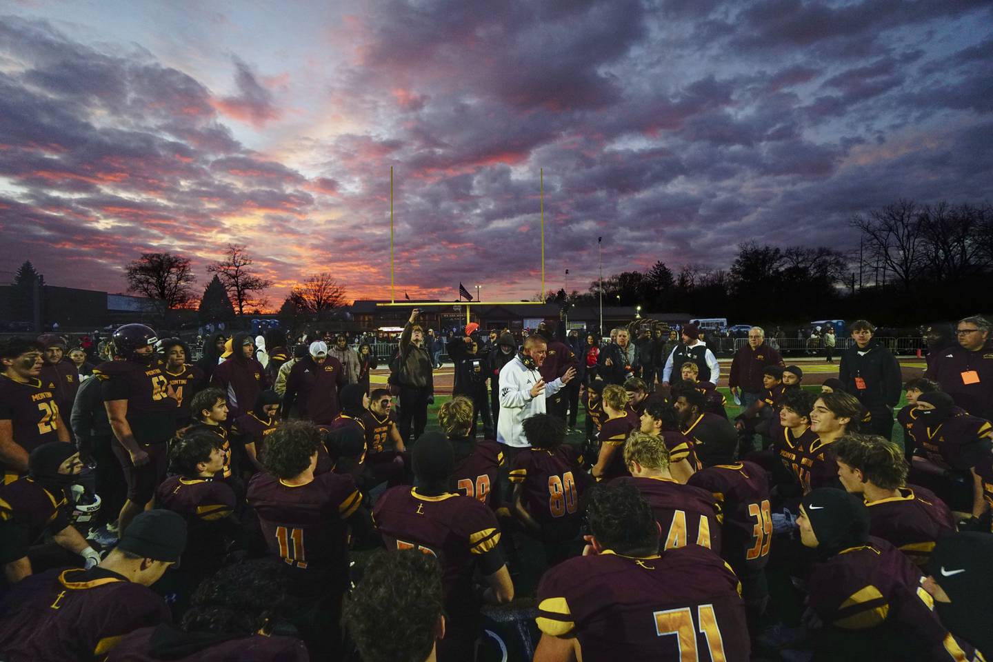 Montini's head coach Mike Bukovsky speaks to his team after winning the IHSA Class 4A semifinals football playoff game Saturday, Nov. 22, 2025 in Lombard.