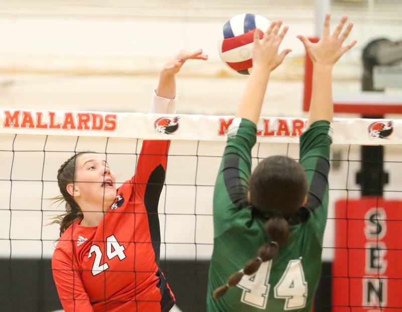 Henry-Senachwine's Harper Schrock has her spike blocked by St. Bede's Hanna Waszowiak on Tuesday, Oct. 21, 2025 at Henry-Senachwine High School.