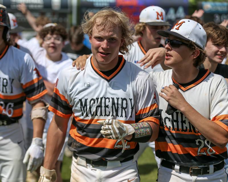 McHenry celebrates with Ricky Powell (22) after he hit the game winner to defeat York in the Class 4A Supersectional game. June 7, 2022.
