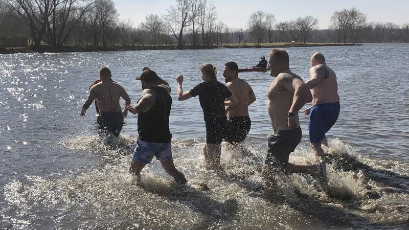 St. Charles police officers and firefighters take the polar plunge to raise money for the Special Olympics on Sunday morning, March 3, 2024 at Fearson Creek Park in St. Charles.