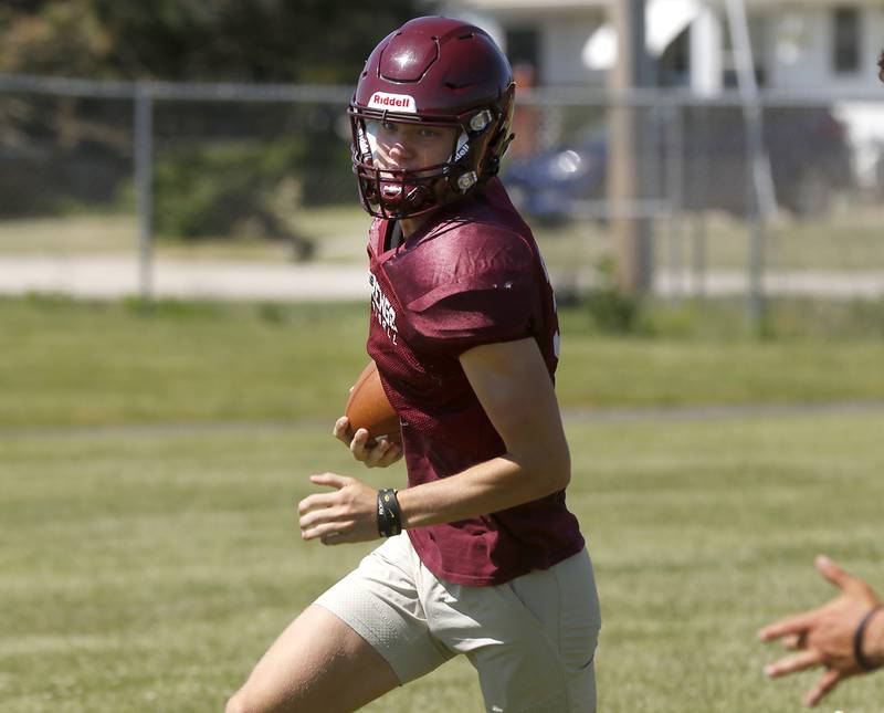 Marengo’s Josh Holst runs with the ball during summer football practice Monday, June 27, 2022, at Marengo Community High School in Marengo.