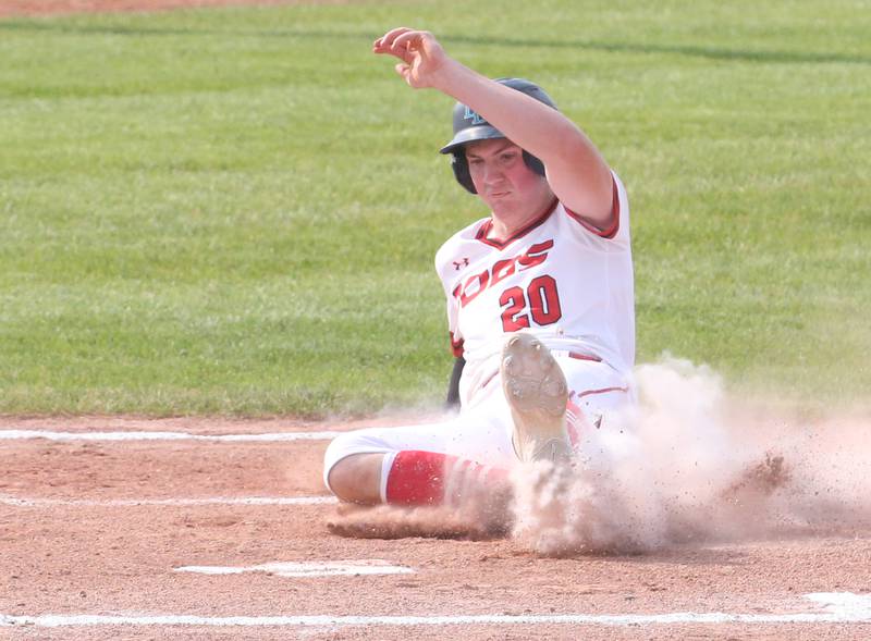Streator's Brady Grabowski slides into home plate to score a run against Richwoods during the Class 3A Sectional semifinal game on Wednesday, May 31, 2023 at Metamora High School.