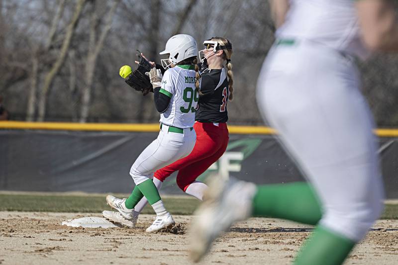 Rock Falls’ Madison Morgan makes it to second just before Forreston’s Navaeh Housten Thursday, March 28, 2024 at Rock Falls High School.