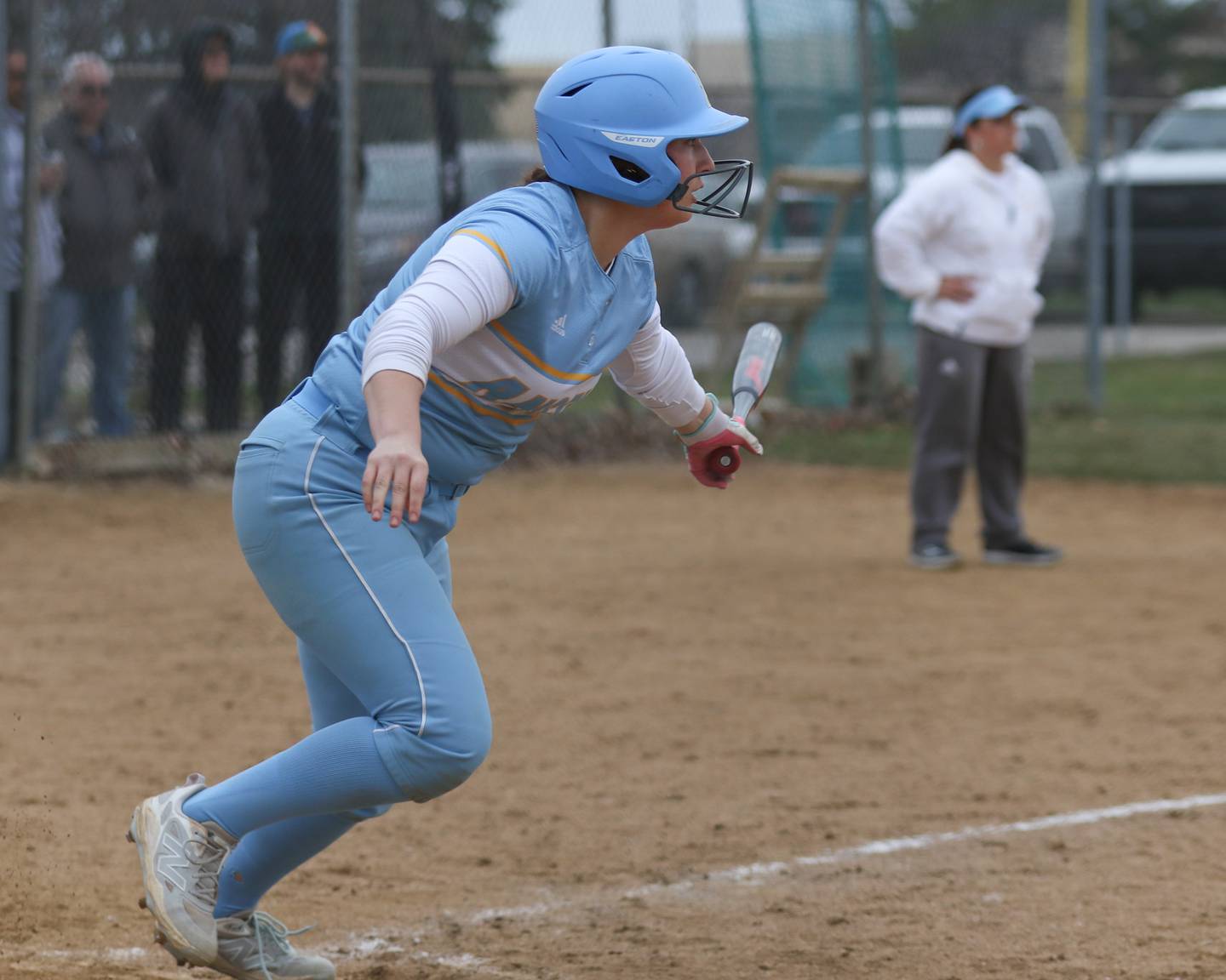 Joliet Catholic's Addison Rizzatto (8) takes off to first while knocking in a run during softball game between Joliet West at Joliet Catholic on Thursday, March 27, 2025  in Joliet.