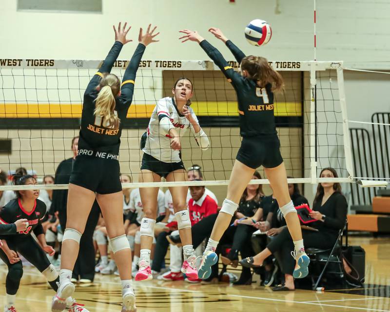 Bolingbrook's Sophia Barrera (5) spikes the ball during regional final volleyball match between Bolingbrook at Joliet West.  Oct 26, 2023.