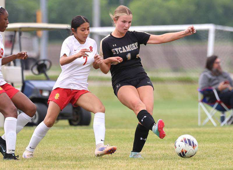 Sycamore's Elizabeth Goff kciks the ball away from Rock Island's Yazmyne Martinez Friday, May 22, 2026, during their Class 2A regional championship matchup at Sycamore High School.