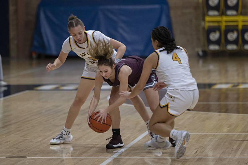 Sterling’s Kirra Gibson (left) and Olivia Turner put pressure on IVC’s Alyvia Fager Monday, Nov. 14, 2022.