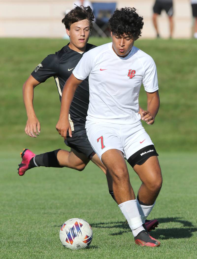 La Salle-Peru's Brayan Gonzalez plays the ball in front of a Sycamore player during their game Wednesday, Sept. 7, 2022, at Sycamore High School.