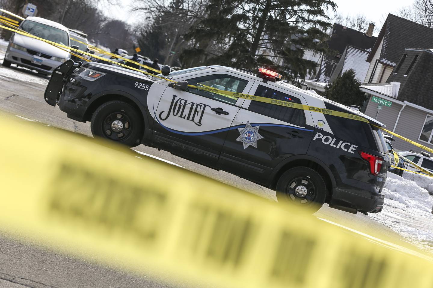 A squad car blocks traffic at the intersection of Ingalls Ave. and Nicholson St. after an officer involved shooting that took place on Thursday, Jan. 28, 2021, in Joliet, Ill.