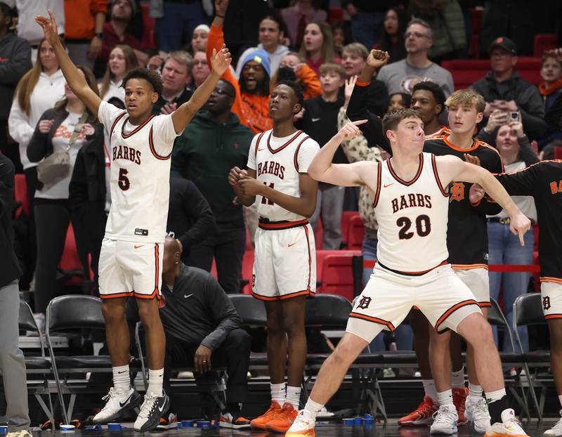 DeKalb players celebrate their win over Sycamore Friday, Jan. 30, 2026, during the FNBO Challenge at the Convocation Center at Northern Illinois University in DeKalb.