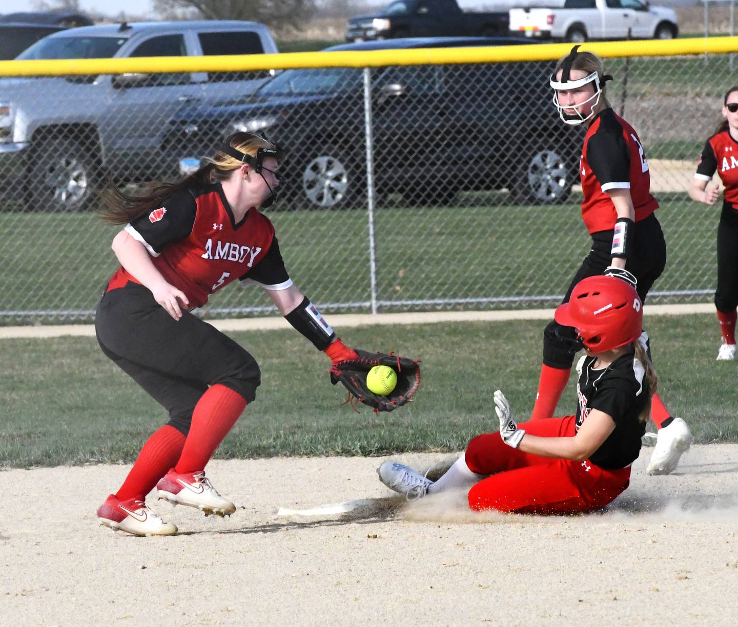 Forreston's Alaina Miller steals second as Amboy's Jersey Thomas tries to tag her during a Thursday, April 13 game in Forreston.