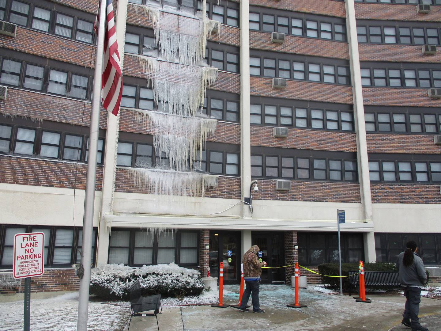 The front entrance to John F. Kennedy Terrace in Joliet was closed Tuesday with sheets of icicles hanging above. Dec. 27, 2022.