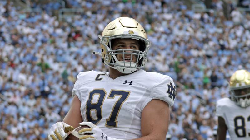 Notre Dame tight end Michael Mayer flashes a smile as he scores a touchdown against North Carolina during the 2022 season.