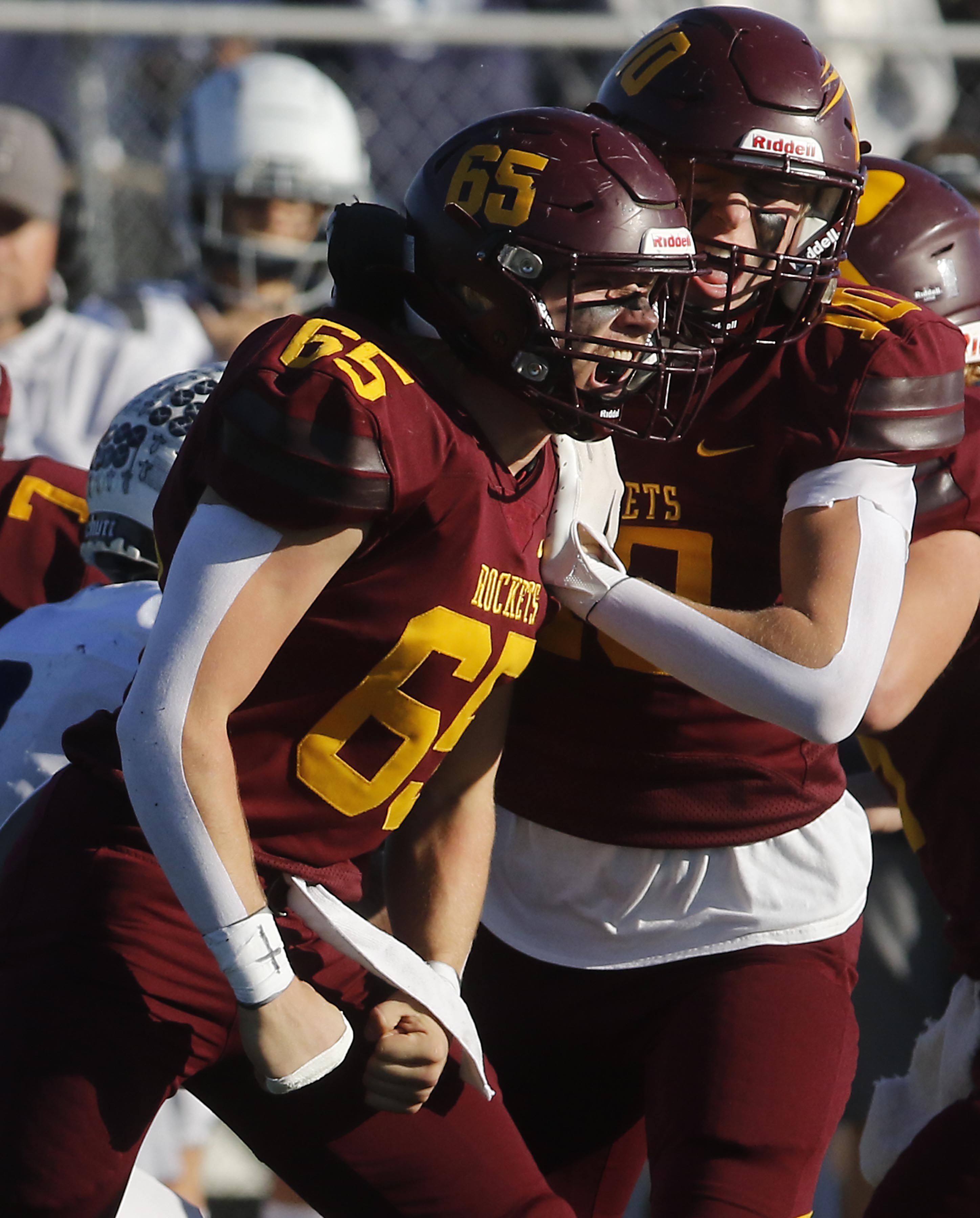 Richmond-Burton's Trevor Szumanski and Luke Robinson celebrates a tackle for a loss during an IHSA Class 3A quarterfinal playoff football game on Saturday, November 15, 2025, at Richmond-Burton High School, in Richmond.
