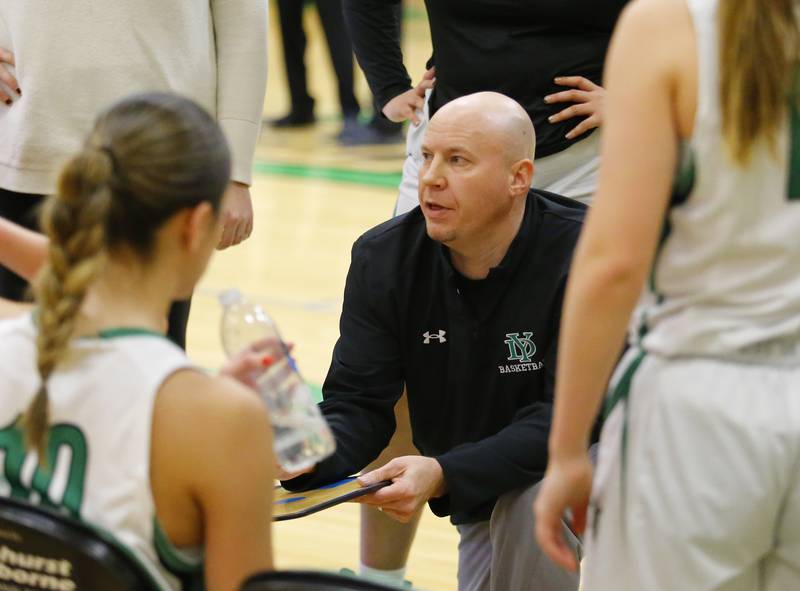 York's coach Brandon Collings talks to the team during the girls varsity basketball game between Lyons Township and York high schools on Friday, Dec. 16, 2022 in Elmhurst, IL.