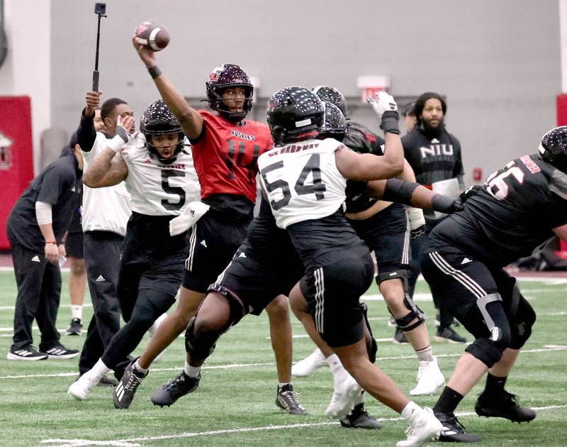 Northern Illinois quarterback Jalen Macon throws the ball from a crowded pocket during the first spring football practice Thursday, March 27, 2025, in the Chessick Practice Center at NIU in DeKalb.