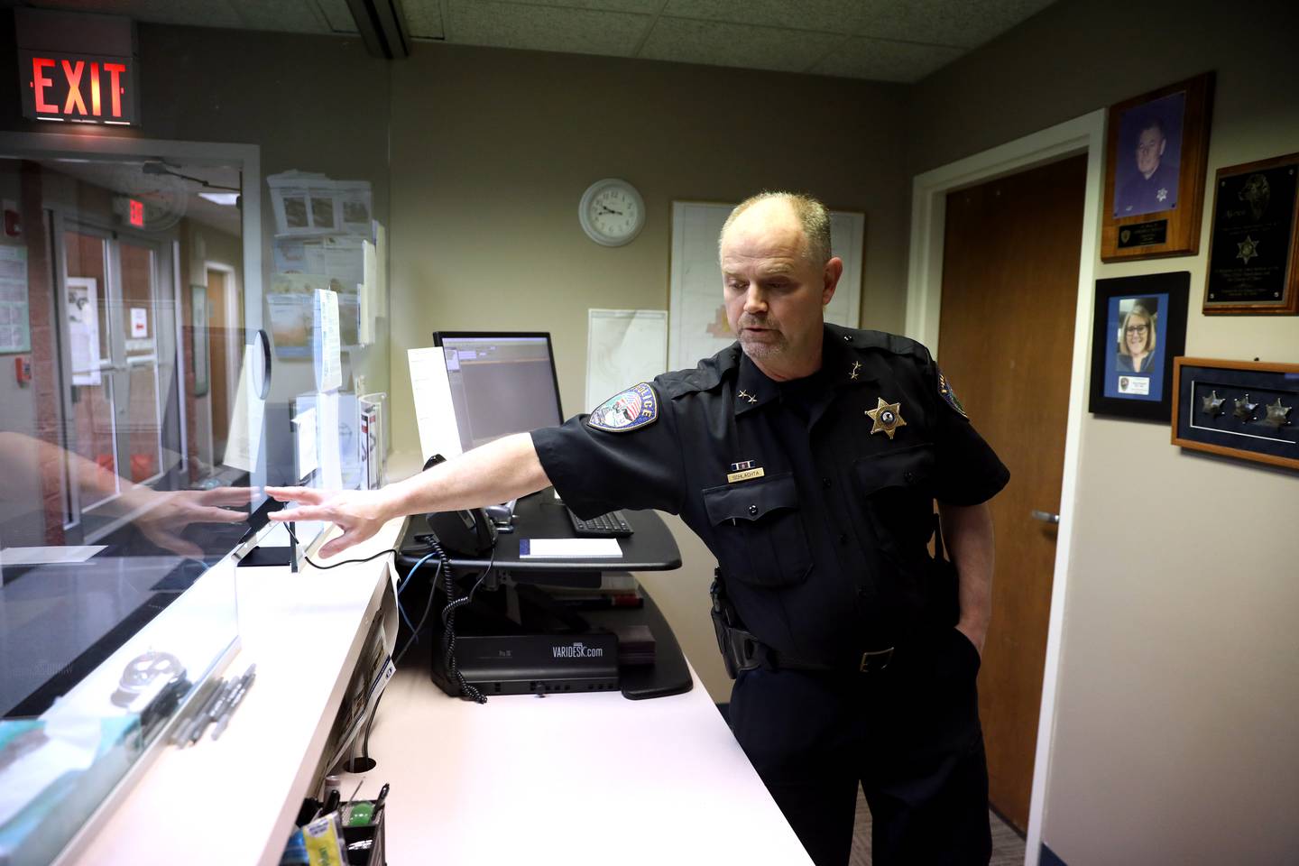 Elburn Police Deputy Chief Erich Schlachta points out the glass at the entrance to their current station, which is not bullet-proof. The department’s referendum for a new station was voted down in the April 4 Consolidated Election.