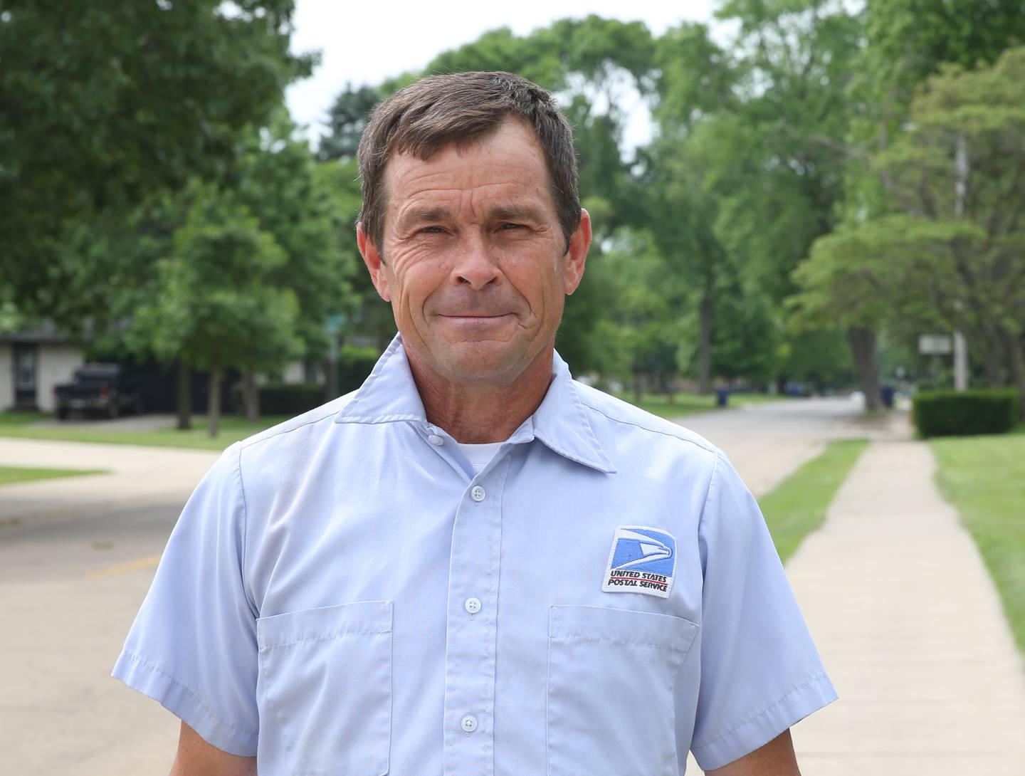 Jay Gerber poses for a photo photo on Bucklin and Oconor Avenue on Monday, May 20, 2024 in La Salle. The Gerber family has been delivering the mail for the United States Postal Service for a combined 60 years in the Illinois Valley. The brothers have recently retired from the USPS.