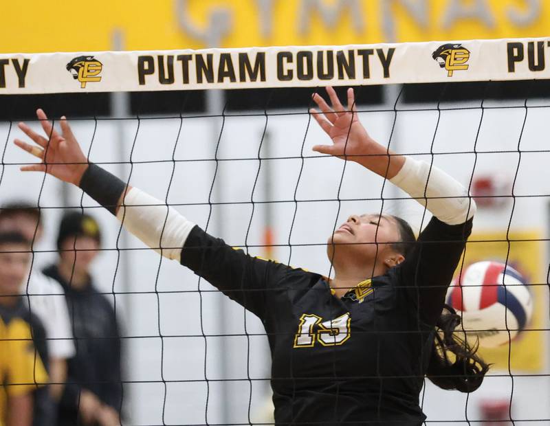 The ball passes behind Putnam County's Britney Trinidad during the Class 1A Regional final on Thursday, Oct. 30, 2025 at Putnam County High School.