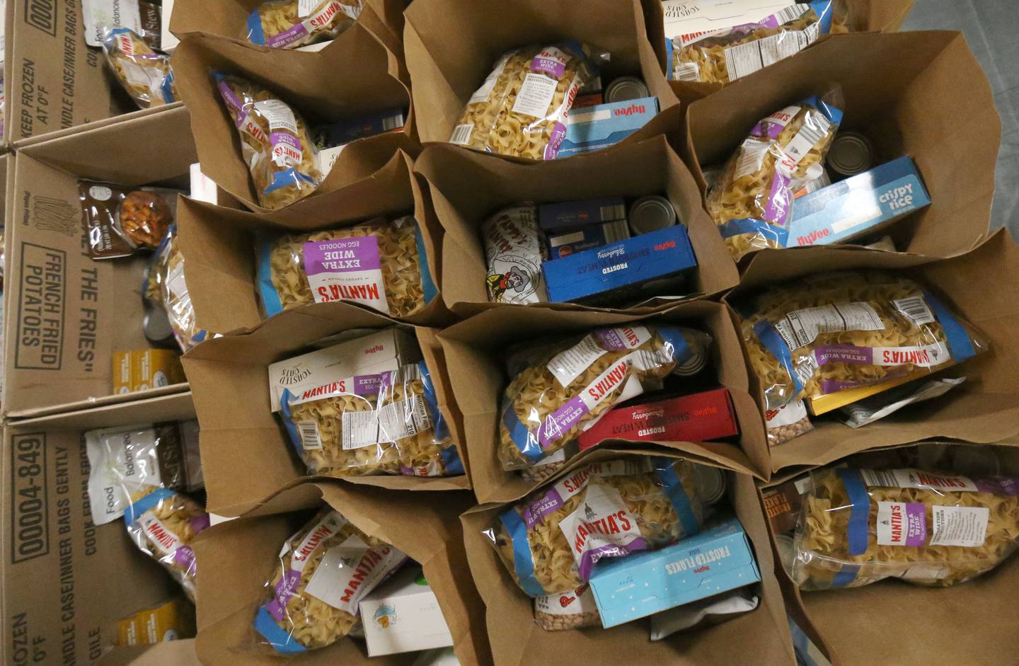Boxes of food fill the floor on Tuesday, Oct. 28, 2025 at the Illinois Valley Food Pantry in Peru. Food assistance used by more than 40 million Americans will not be distributed from November due to the ongoing US government shutdown. Food shortage will worsen local food pantries due to the the shutdown.