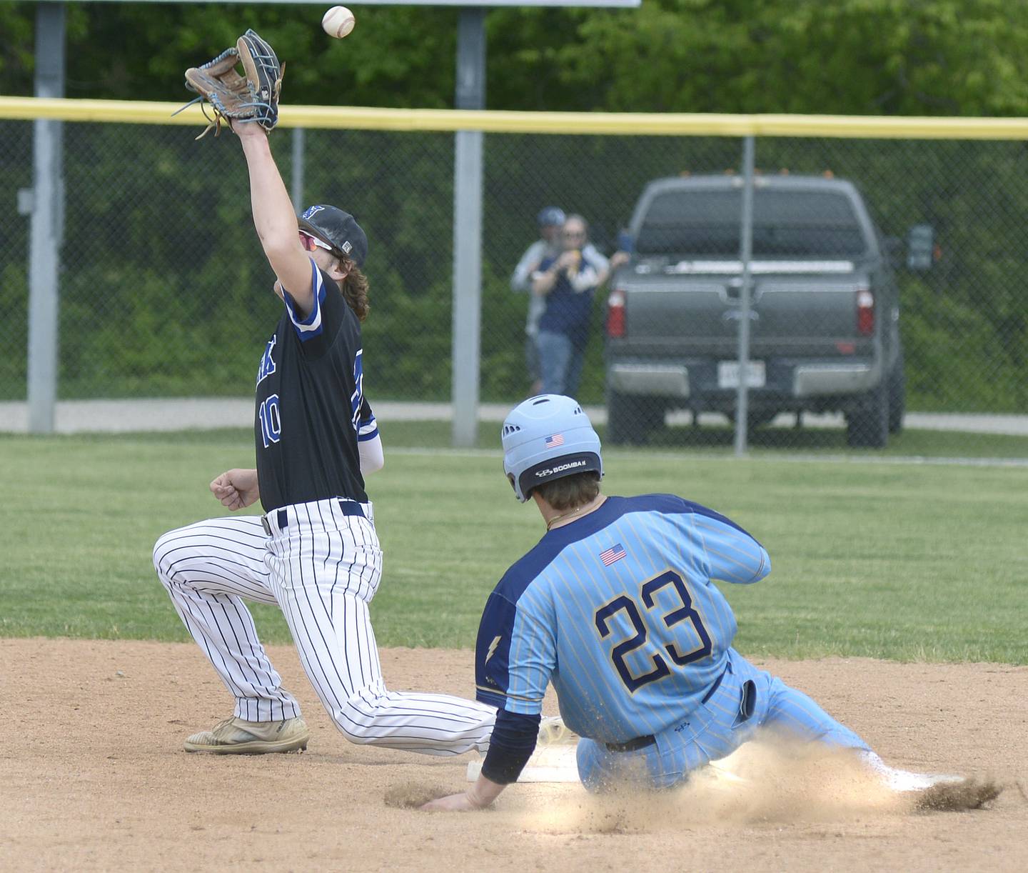 The ball sails away from Newark’s Toby Steffen as Marquette’s Grant Dose steals second base Saturday at Masinelli Field.