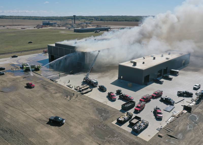 Smoke billows from Marquis Energy as firefighters work to control a structure fire on Wednesday, Oct. 8, 2025 in Hennepin. The fire was upgraded to a 5th alarm dispatching the (MABAS) Mutual Aid Box Alarm System. The fire broke out around 11a.m.