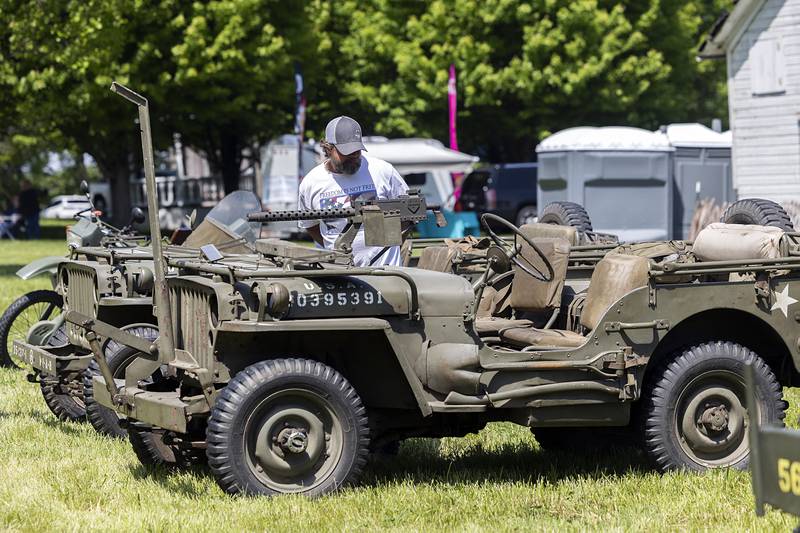 Visitors check out the World War II-era Jeeps on display Saturday, May 16, 2026, in Franklin Grove.