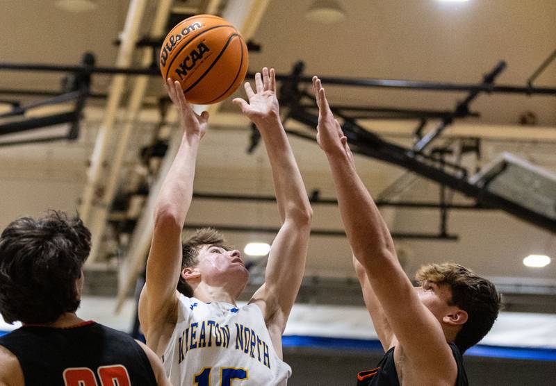 Wheaton North’s Briggs Barnick goes up for a layup during a game against Wheaton Warrenville South on Friday, Dec. 20, 2024.