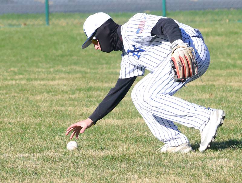 Newark's Shawn Seyller bare hands the ball after bobbling it against Marquette on Monday, March 23, 2026 at Newark High School.