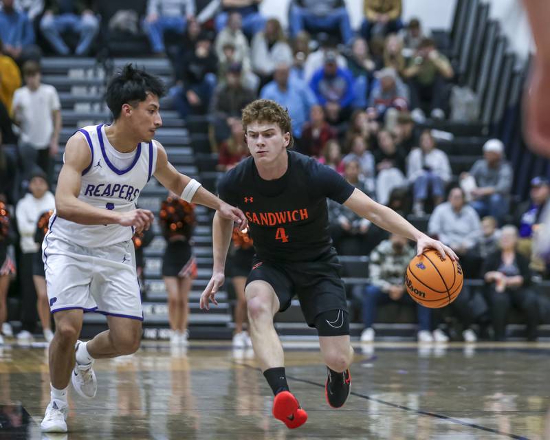 Sandwich's Griffin Somlock (4) drives past the defense of Plano's Alan Contreras (1) during their basketball game between Sandwich at Plano Tuesday, Dec 9, 2025 in Plano.