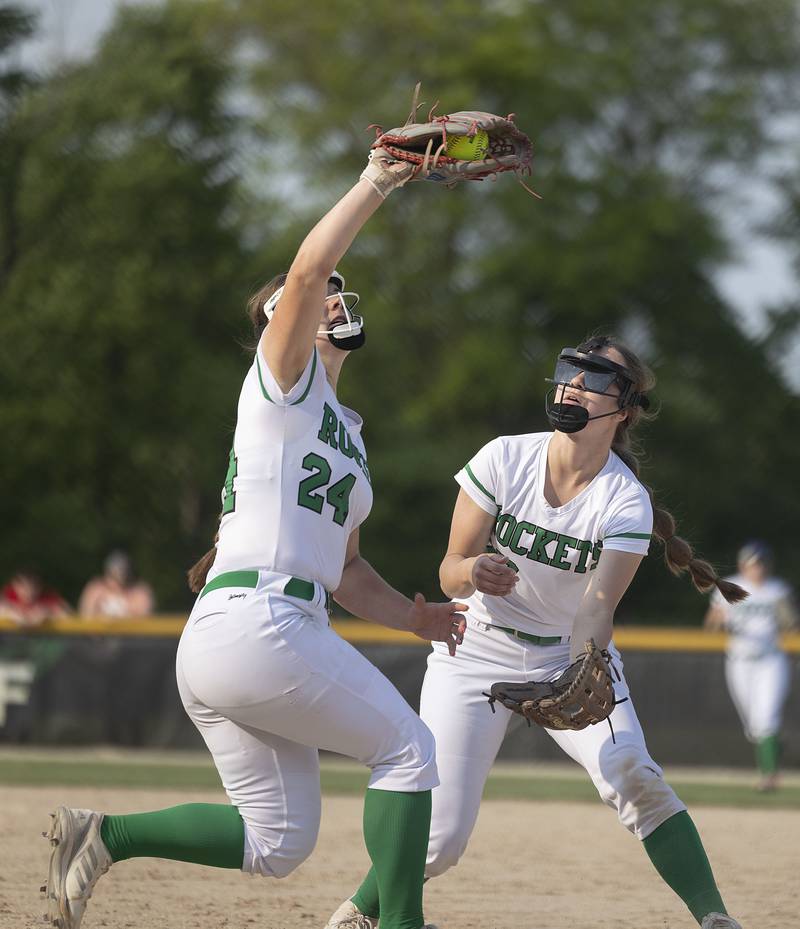 Rock Falls’ Katie Thatcher snags a pop up in front of Brooke Howard Friday, May 19, 2023.