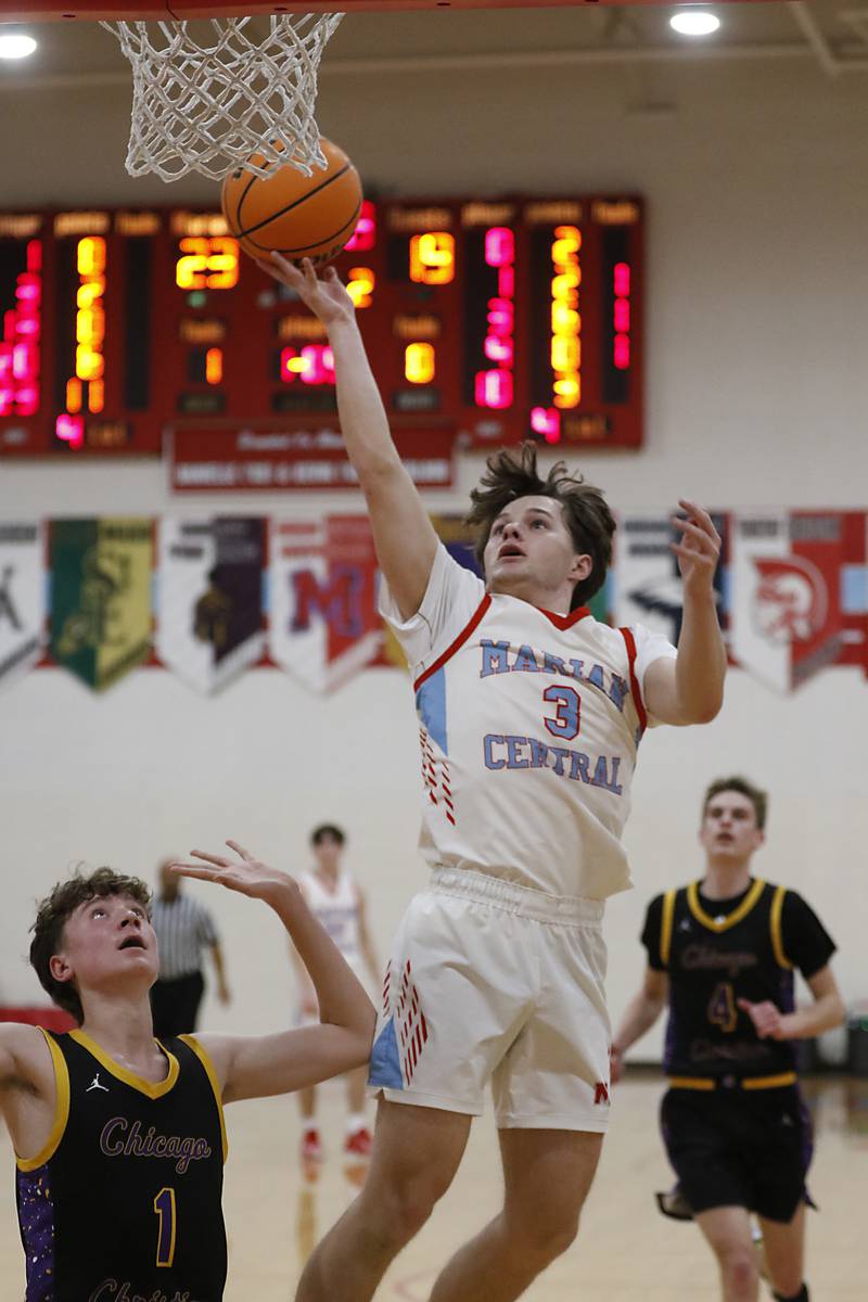 Marian Central's Logan Brandt shoots the ball over Chicago Christian's Garrett Murphy during a Chicagoland Christian Conference basketball game on Tuesday, Jan. 21, 2025, at Marian Central High School.
