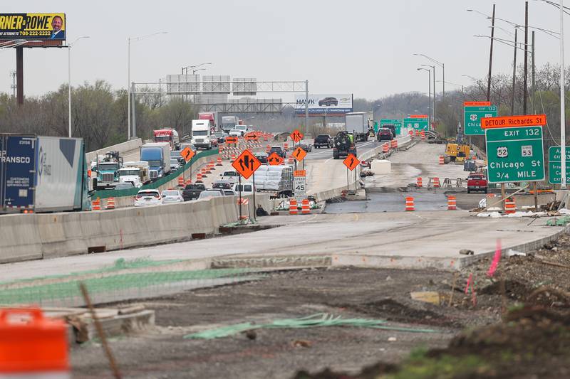 Construction continues as traffic travels along Interstate 80 near the Richards exit on Thursday, April 11, 2024 in Joliet.