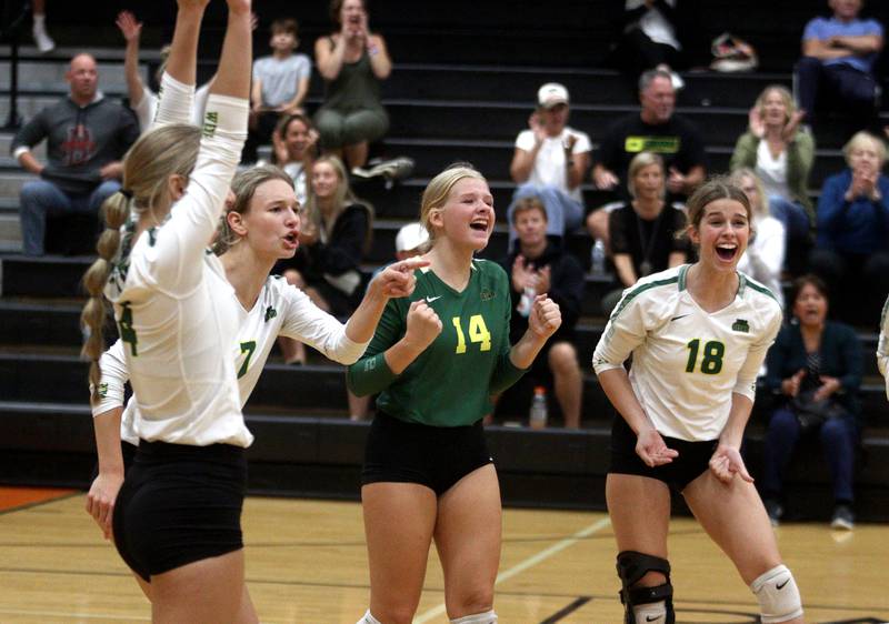 Crystal Lake South’s Gators celebrate a three-set win in varsity volleyball at McHenry Tuesday night.