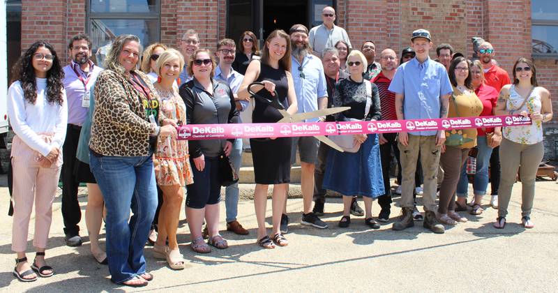 The DeKalb Chamber of Commerce welcoming Rock Auction Gallery with a ribbon-cutting