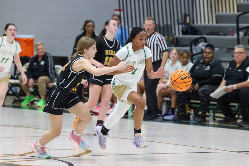 Bishop McNamara's Hailey Jackson breaks away with a steal during their 60-36 victory over Reed-Custer in the IHSA Class 2A Bishop McNamara Regional semifinals on Monday, Feb. 16, 2026.