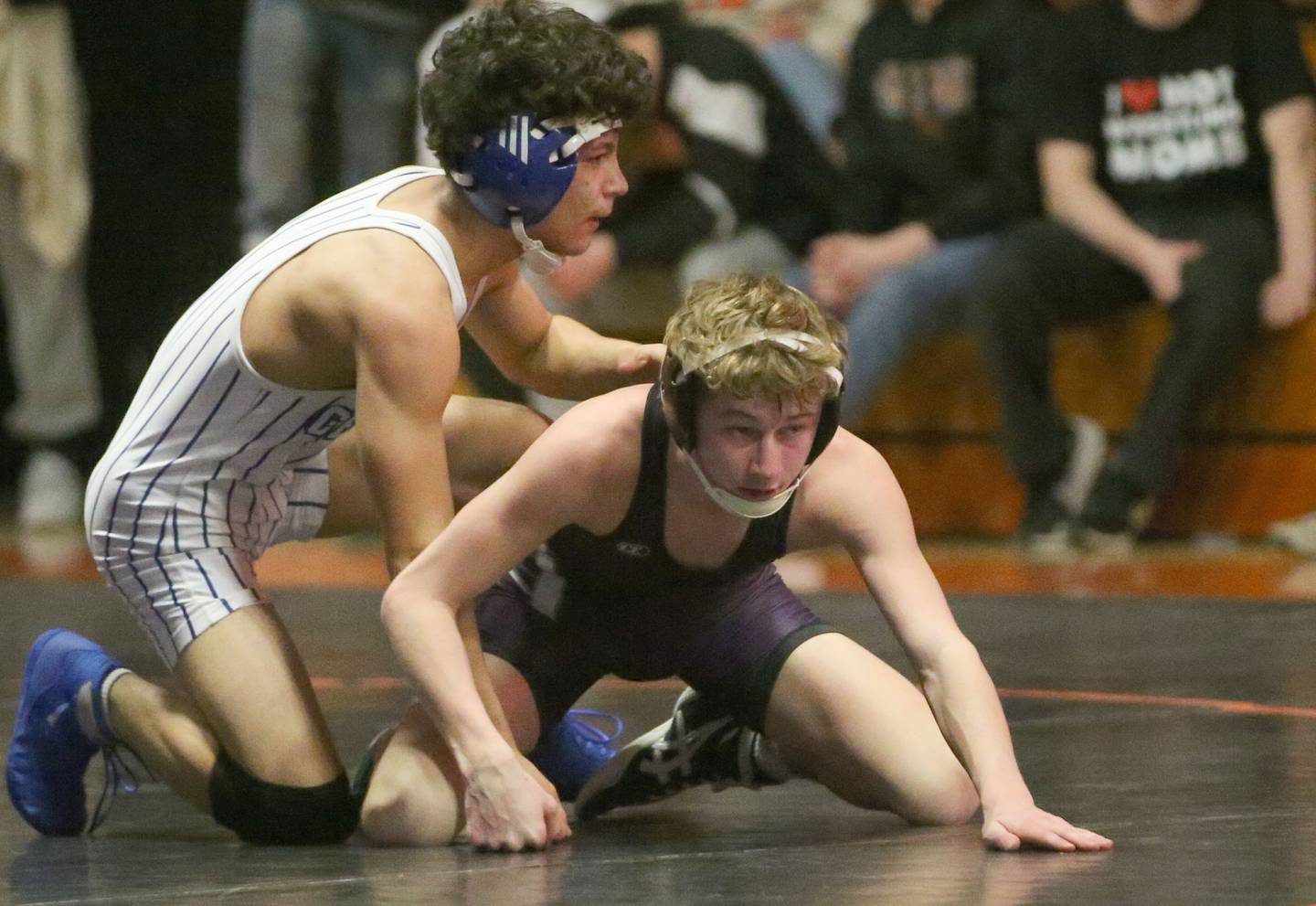 Dixon's Jack Regan (bottom) wrestles Burlington's Eduardo Vences in the 113 weight class during the Class 2A Sectional championship on Saturday, Feb. 15, 2025 at Washington High School.
