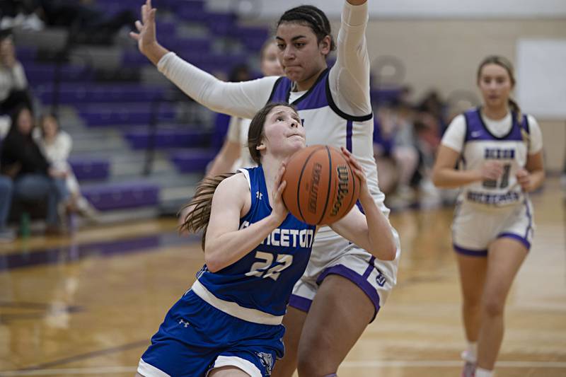 Princeton’s Camryn Driscoll puts up a shot against Dixon’s Hallie Williamson Thursday, Jan. 4, 2024 at Dixon High School.