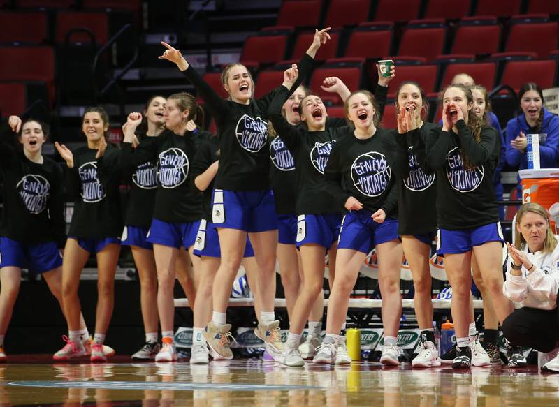 Members of the Geneva girls basketball team react after a player scores a basket during the Class 4A third place game on Friday, March 3, 2023 at CEFCU Arena in Normal.