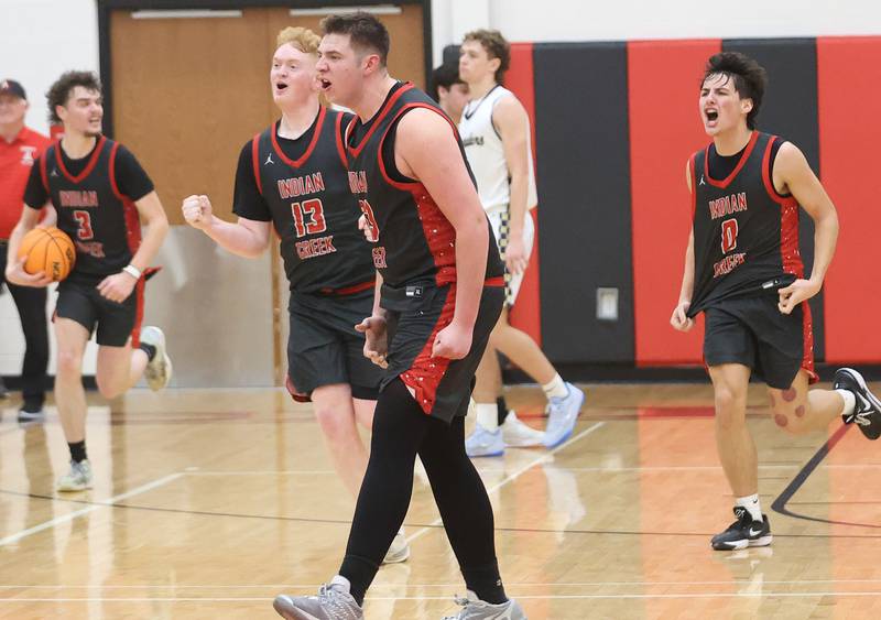 Indian Creek's Payton Hueber, Isaac Willis, and Cooer Rissman react after defeating Marquette during the Class 1A Sectional game on Friday, March 6, 2026 at Amboy High School.