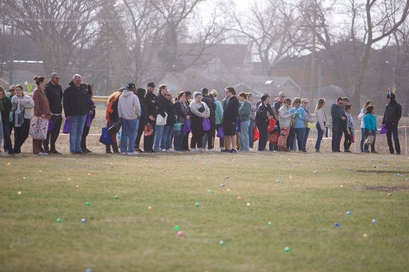 Adults gather for the Adult Easter Egg Hunt on Saturday, March 15, 2025 at Berens Park in Elmhurst.